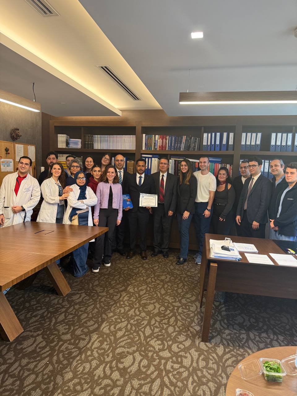 Dr. Surafel Mekonnen receiving his pediatric neurosurgery fellowship certificate with the division team at Acıbadem University, Istanbul