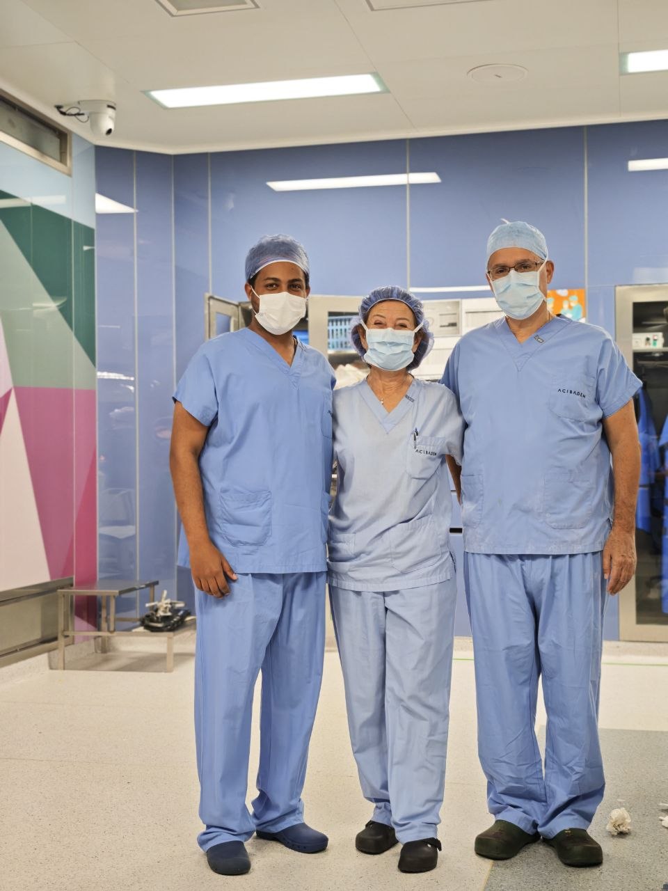 Dr. Surafel Mekonnen in theatre scrubs with colleagues at Acibadem University Hospital, Istanbul